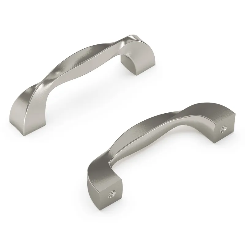 Elegant twisted satin nickel cabinet pulls, featuring a brushed metal texture, exemplify contemporary kitchen hardware and interior design trends for modern home remodels.