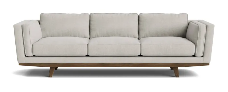 This modern sofa features textured cream natural fiber upholstery on a sleek wooden base, offering a stylish and eco-friendly furniture design.